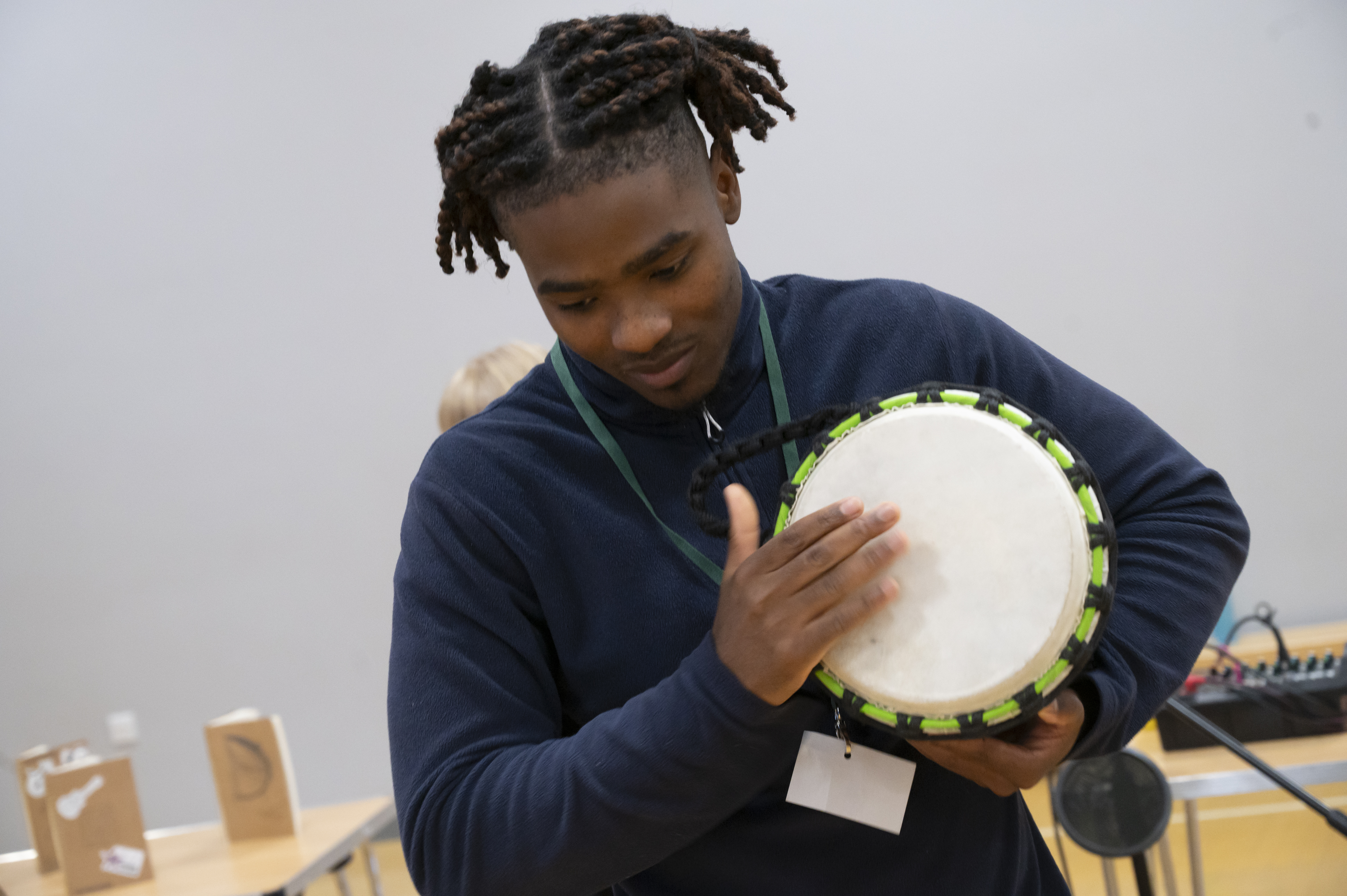 Workshop participant experimenting with music - Image 1
